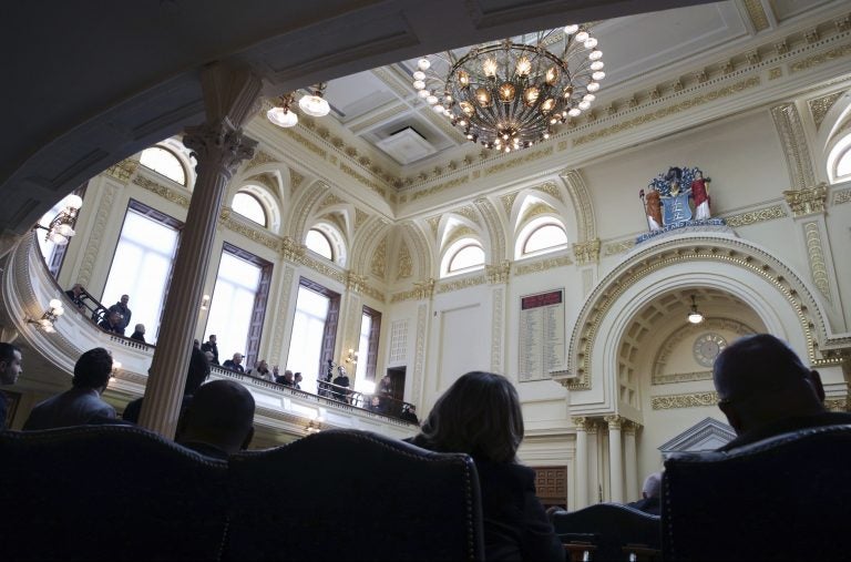 People listen as the New Jersey Assembly considers and votes on a half-dozen gun control bills Monday, March 26, 2018, in the Statehouse in Trenton, N.J.