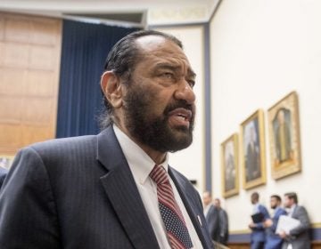 Rep. Al Green, D-Texas, right, speaks to visitors during a break from testimony from David Marcus, CEO of Facebook's Calibra digital wallet service, before a House Financial Services Committee hearing on Facebook's proposed cryptocurrency on Capitol Hill in Washington, Wednesday, July 17, 2019. Green has introduced a resolution in the House to impeach President Donald Trump. (Andrew Harnik/AP Photo)