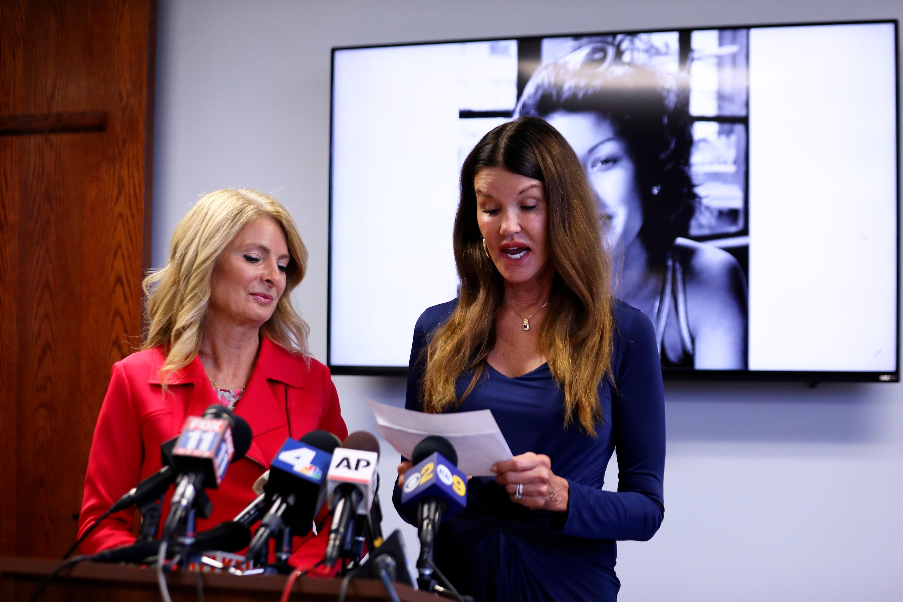 Model Janice Dickinson, (right), speaks at a press conference, Thursday, July 25, 2019, in Los Angeles, announcing a settlement of her defamation lawsuit against comedian Bill Cosby. The deal allows Dickinson to continue to speak out against Cosby. Looking on at left is Dickinson's attorney Lisa Bloom. (Katherine Campione/AP Photo)