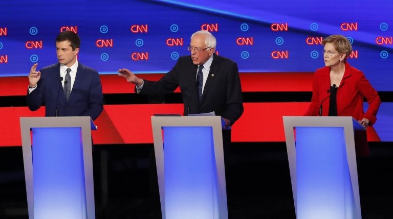 South Bend Mayor Pete Buttigieg, Sen. Bernie Sanders, I-Vt., and Sen. Elizabeth Warren, D-Mass., participate in the first of two Democratic presidential primary debates hosted by CNN Tuesday, July 30, 2019, in the Fox Theatre in Detroit. (Paul Sancya/AP Photo)