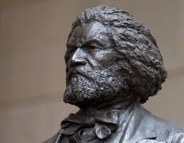 A bronze statue of 19th-century orator and writer Frederick Douglass is seen in the Emancipation Hall of the United States Visitor Center on Capitol Hill in Washington, Wednesday, June 19, 2013, where it was dedicated. The bronze statue of Douglass is by Maryland artist Steve Weitzman. (Carolyn Kaster/AP Photo)