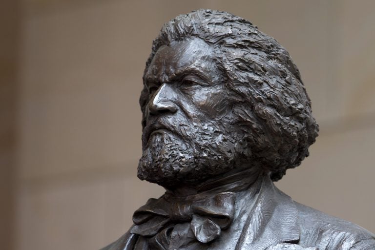 A bronze statue of 19th-century orator and writer Frederick Douglass is seen in the Emancipation Hall of the United States Visitor Center on Capitol Hill in Washington, Wednesday, June 19, 2013, where it was dedicated. The bronze statue of Douglass is by Maryland artist Steve Weitzman. (Carolyn Kaster/AP Photo)