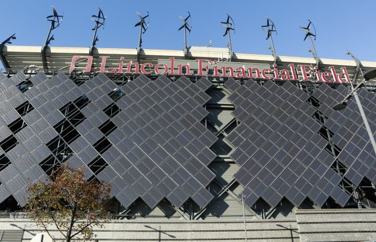 Micro-wind turbines and solar panels installed at Lincoln Financial Field in Philadelphia are pictured Wednesday, November 19, 2014. (Mark Stehle/Invision for NRG/AP Images)