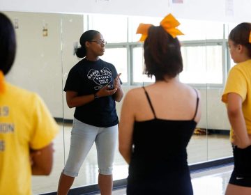 Kensington High School cheerleading coach Amber Rawls leads practice in the dance studio at Kensington High School for the Creative and Performing Arts (KCAPA) on June 6, 2019. (Photo by Maggie Loesch)