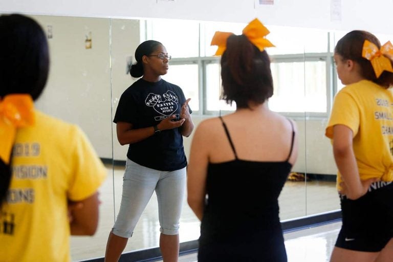 Kensington High School cheerleading coach Amber Rawls leads practice in the dance studio at Kensington High School for the Creative and Performing Arts (KCAPA) on June 6, 2019. (Photo by Maggie Loesch)