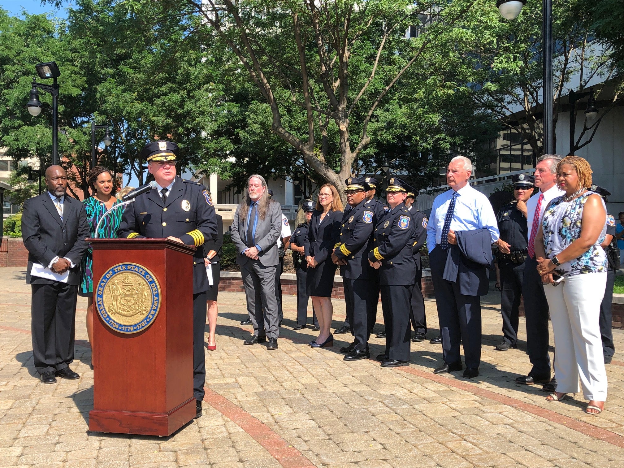 Wilmington police chief Robert Tracy, flanked by city and state officials,