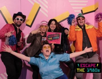 Employees at Escape the 1980s (from left to right): John Foster, Jennaphr Frederick, Elisabeth Garson, Nick Einstman, and Krystle Ann Griffin in the game room's photo booth.  (Image courtesy of Escape the 1980s)