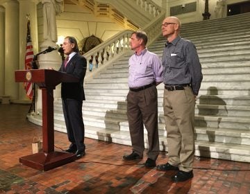 Attorney Richard Serbin (left) and Don Asbee (right) announce the lawsuit at the state Capitol in Harrisburg. David Clohessy, with the Survivors Network of those Abused by Priests, is at center.