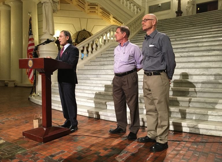 Attorney Richard Serbin (left) and Don Asbee (right) announce the lawsuit at the state Capitol in Harrisburg. David Clohessy, with the Survivors Network of those Abused by Priests, is at center.