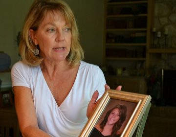 Martha Stringer holds a photo of her daughter, Kim, from when she was in high school. Kim is 27 now. (Brett Sholtis/WITF)