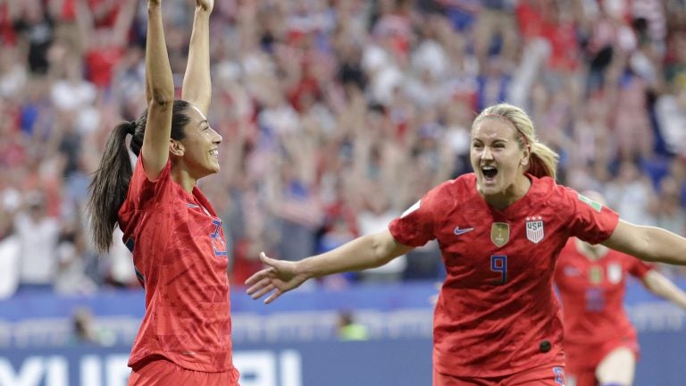 Christen Press (left) celebrates after scoring the U.S.'s first goal during the Women's World Cup semifinal against England. The U.S. won 2-1. (Alessandra Tarantino/AP)