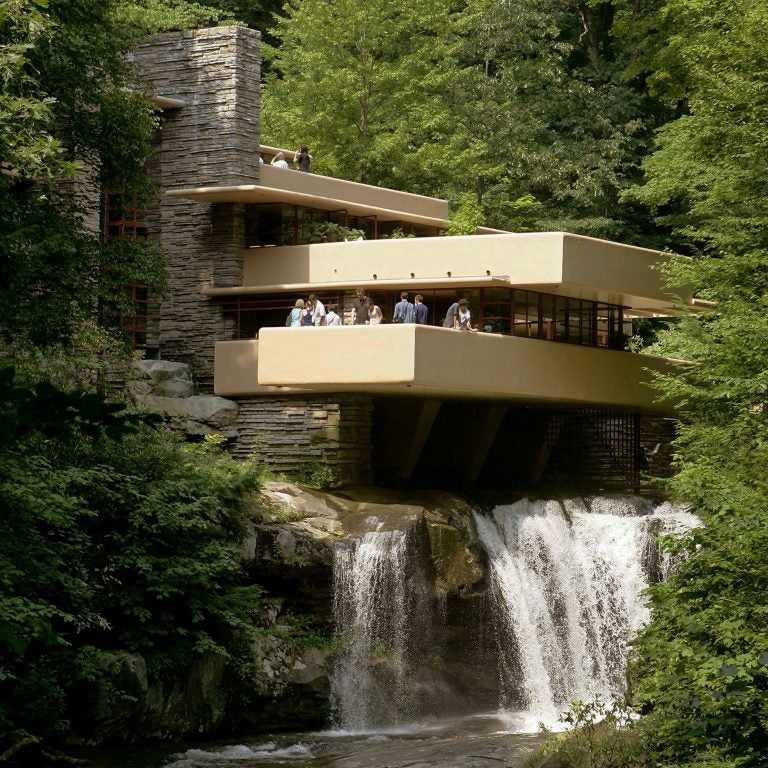 Visitors gather on one of the cantilevered terraces at Fallingwater, a Frank Lloyd Wright design in Pennsylvania. Eight Wright buildings, including Fallingwater, were honored as World Heritage sites by UNESCO, on July 7, 2019. (Keith Srakocic/AP)