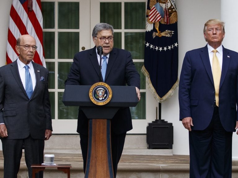 Attorney General William Barr speaks as he stands with President Donald Trump and Commerce Secretary Wilbur Ross during an event about the census in the Rose Garden at the White House earlier this month. (Carolyn Kaster/AP Photo)