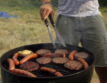 When it comes to Fourth of July barbecue etiquette, Bon Appetit food director Carla Lalli Music says you should avoid hovering if you are a guest. If you want to be helpful, she says, bring some extra ice or non-alcoholic drinks. (Alex Brandon/AP Photo)