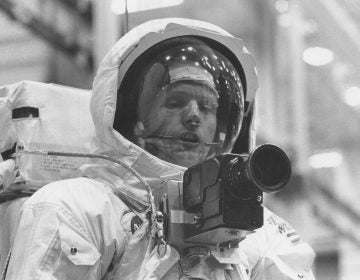 Neil Armstrong tests out his spacesuit and camera in April 1969, three months before he would actually set foot on the moon. (NASA/Project Apollo Archive)