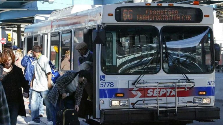Commuters are shown exiting a SEPTA bus. (AP Photo/Joseph Kaczmarek, file)