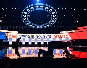 Workers prepare the debate stage at the Fox Theatre in Detroit ahead of Tuesday's Democratic presidential debate. (Jim Watson/AFP/Getty Images)