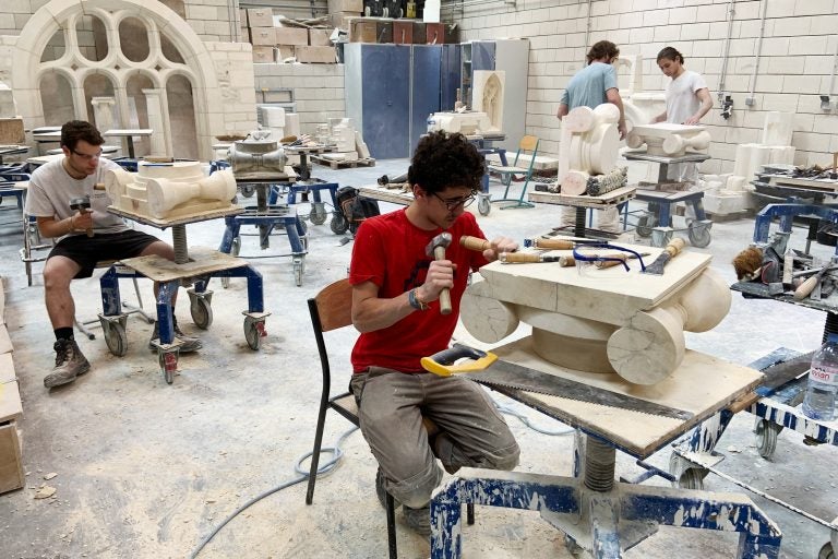 Students chip and chisel away at heavy slabs of stone in the workshops of the Hector Guimard high school, less than three miles from Paris' Notre Dame cathedral. (Eleanor Beardsley/NPR)