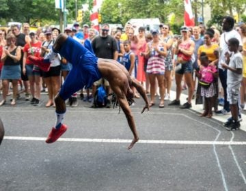 Acrobatic performers wowed the crowd at the Welcome America Party on the Parkway. (Michael Reeves/Billy Penn)