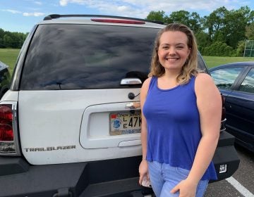 Shelby Deibler, 17, uses the state-mandated red tags, even though she’s wary about the idea. She said she would rather be cautious and wants to avoid paying the fine if she happens to be pulled over. (Andrew Rowan for WHYY)
