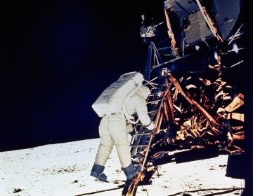 Astronaut Edwin E. Aldrin, Jr., lunar module pilot, descends steps of Lunar Module ladder as he prepares to walk on the moon, July 20, 1969. This picture was taken by astronaut Neil A. Armstrong, Commander