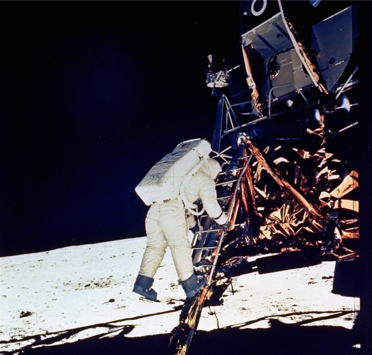 Astronaut Edwin E. Aldrin, Jr., lunar module pilot, descends steps of Lunar Module ladder as he prepares to walk on the moon, July 20, 1969. This picture was taken by astronaut Neil A. Armstrong, Commander