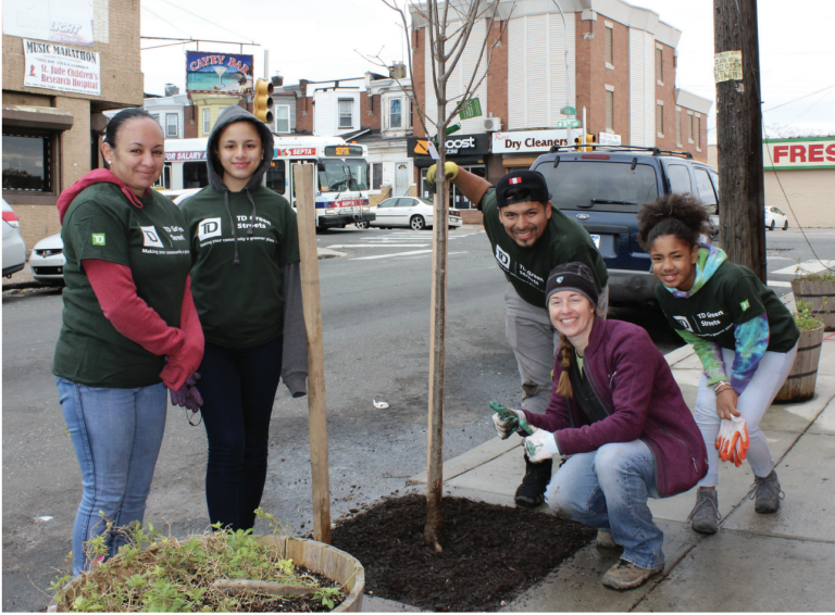 Volunteers working with a city Tree Tenders group plant trees in Hunting Park. (City of Philadelphia)