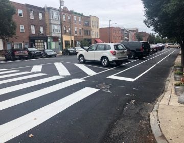 Philadelphia recently repaved South 11th Street, creating new parking-protected bike lanes, as seen here. (Darryl Murphy/WHYY)