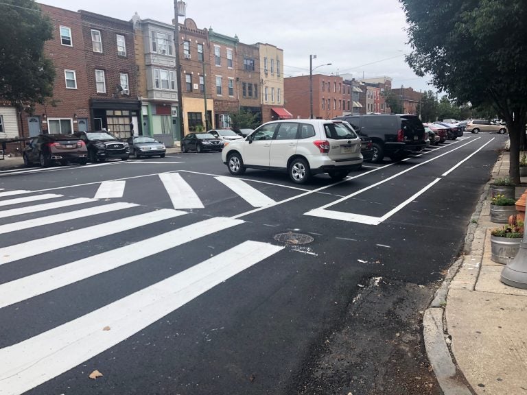 Philadelphia recently repaved South 11th Street, creating new parking-protected bike lanes, as seen here. (Darryl Murphy/WHYY)