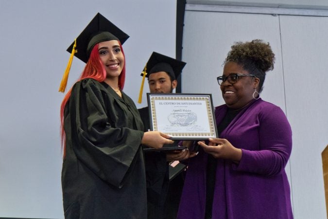 Amanda Zeledon accepts honors from El Centro counselor Angie Smith. (Kimberly Paynter/Keystone Crossroads)