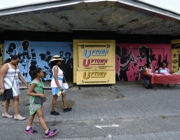 People walk past the Uptown Theater on the 2200 block of North Broad Street. Visitors had the chance to see the theater from the inside during the annual Philly Free Streets event. (Bastiaan Slabbers for WHYY)