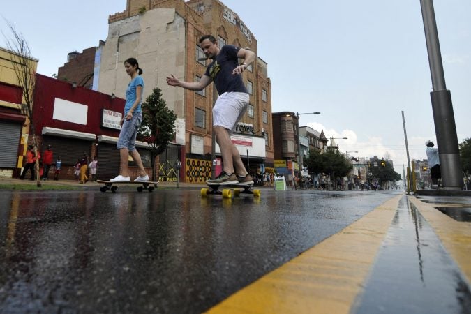 People walk, stroll and roll on North Broad Street during Philly Free Streets. (Bastiaan Slabbers for WHYY)