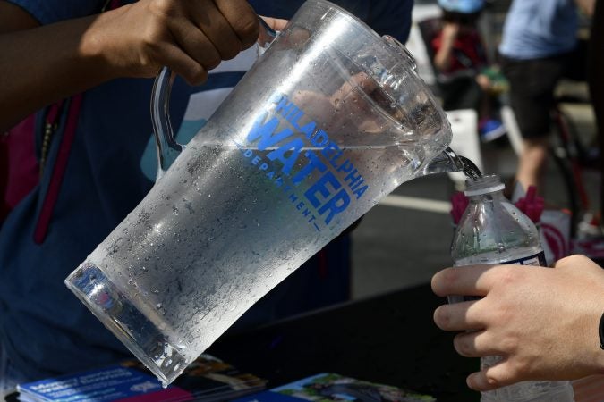 Participants refill their water at a Philly Water Bar during Free Streets on Saturday. (Bastiaan Slabbers for WHYY)