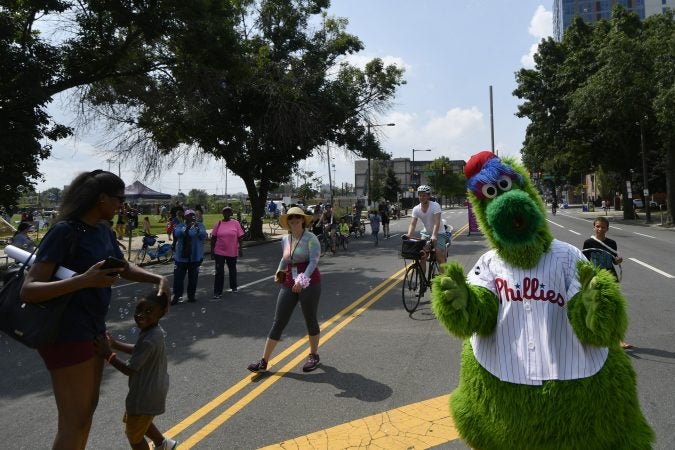 The Philly Phanatic gives two thumbs up as people enjoy Philly Free Streets on North Broad Street on Saturday. (Bastiaan Slabbers for WHYY)