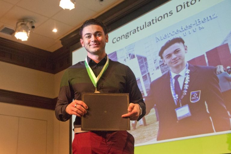 Dito Sakhokia, 18, from George Washington High School in Philadelphia receives the TD Bank Young Heroes Award at the National Liberty Museum. A recent immigrant and student of English, Sakhokia won multiple awards for public speaking. (Kimberly Paynter/WHYY)