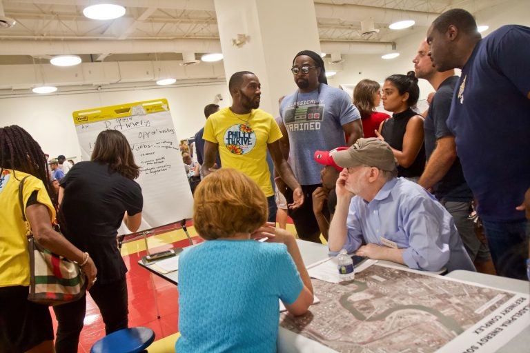 Members of the Southwest Philadelphia community discuss ideas for what to do at the PES refinery. (Kimberly Paynter/WHYY)