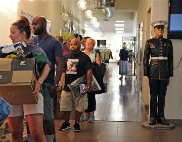 Shoppers line up at check out at I. Goldberg, which will close on Friday after 100 years in Philadelphia. (Emma Lee/WHYY)