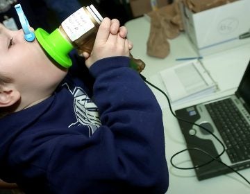 Tanner Little breathes into a spirometer that measures his lung capacity at Greenville Elementary School, Thursday, Feb. 1, 2007 in North Logan Utah.  (AP Photo/The Herald Journal, Eli Lucero)