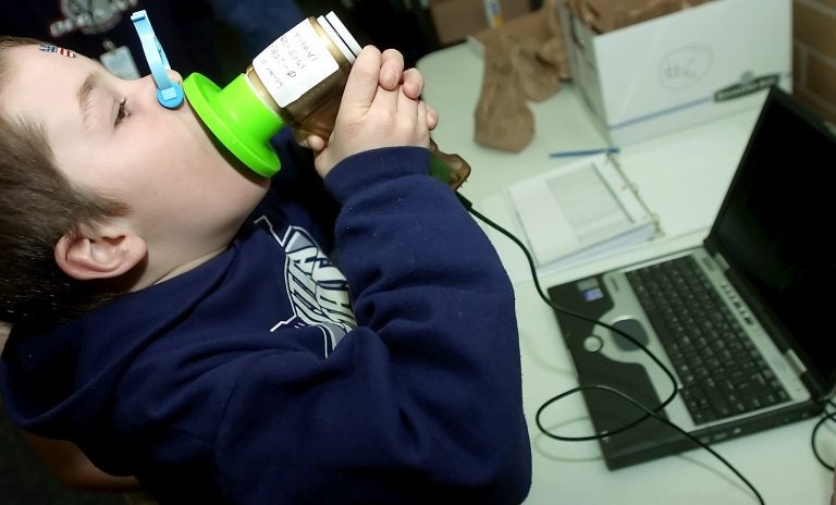 Tanner Little breathes into a spirometer that measures his lung capacity at Greenville Elementary School, Thursday, Feb. 1, 2007 in North Logan Utah.  (AP Photo/The Herald Journal, Eli Lucero)