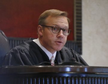 In this Monday, July 8, 2019 file photo, Judge Thad Balkman speaks during Oklahoma's case blaming consumer products giant Johnson & Johnson and its subsidiaries for the state's opioid drug crisis, in Norman, Okla. (Sue Ogrocki/AP Photo, File)