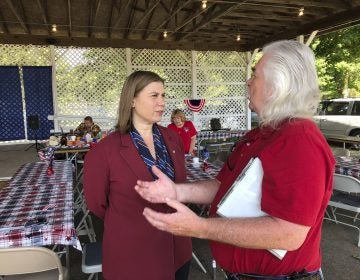 Rep. Elissa Slotkin, D-Mich., talks with a constituent after a veterans event on Friday, Aug. 2, 2019, at the Ingham County Fair in Mason, Mich. Slotkin, who flipped the 8th Congressional District by defeating a Republican incumbent in 2018, has not backed an impeachment inquiry of President Donald Trump. (David Eggert/AP Photo)