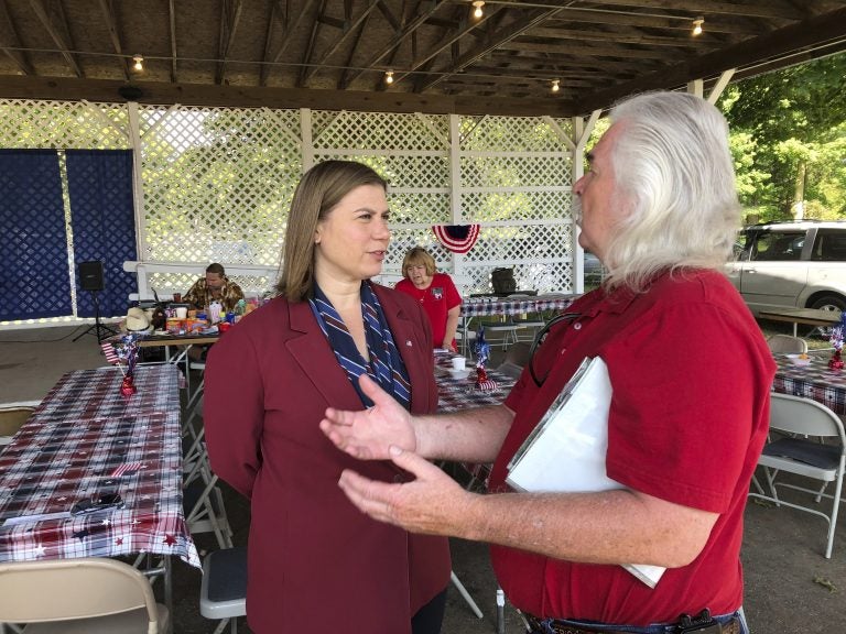 Rep. Elissa Slotkin, D-Mich., talks with a constituent after a veterans event on Friday, Aug. 2, 2019, at the Ingham County Fair in Mason, Mich. Slotkin, who flipped the 8th Congressional District by defeating a Republican incumbent in 2018, has not backed an impeachment inquiry of President Donald Trump. (David Eggert/AP Photo)