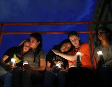 From left, Melody Stout, Hannah Payan, Aaliyah Alba, Sherie Gramlich and Laura Barrios comfort each other during a vigil for victims of the shooting Saturday, Aug. 3, 2019, in El Paso, Texas. A young gunman opened fire in an El Paso, Texas, shopping area during the busy back-to-school season, leaving multiple people dead and more than two dozen injured. (John Locher/AP Photo)