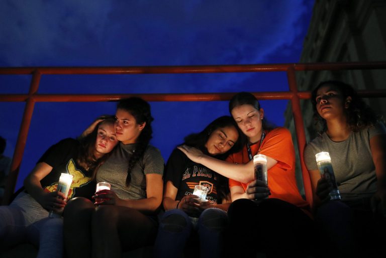 From left, Melody Stout, Hannah Payan, Aaliyah Alba, Sherie Gramlich and Laura Barrios comfort each other during a vigil for victims of the shooting Saturday, Aug. 3, 2019, in El Paso, Texas. A young gunman opened fire in an El Paso, Texas, shopping area during the busy back-to-school season, leaving multiple people dead and more than two dozen injured. (John Locher/AP Photo)