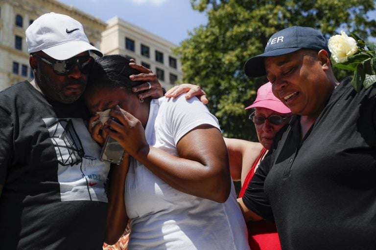 Mourners gather at a vigil following a nearby mass shooting, Sunday, Aug. 4, 2019, in Dayton, Ohio. Multiple people in Ohio have been killed in the second mass shooting in the U.S. in less than 24 hours, and the suspected shooter is also deceased, police said. (John Minchillo/AP Photo)