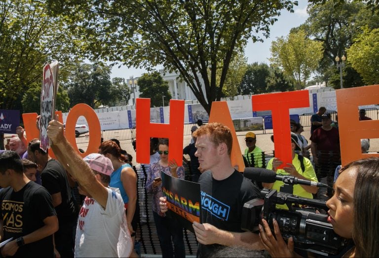 Adam Friedman, 19, a youth organizer with the Brady Campaign To Prevent Gun Violence, holds a sign saying 