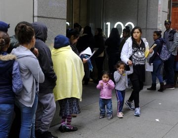 In this Jan. 31, 2019, file photo, hundreds of people overflow onto the sidewalk in a line snaking around the block outside a U.S. immigration office with numerous courtrooms in San Francisco.  (Eric Risberg/AP Photo, File)