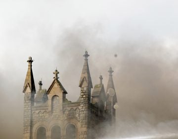 Greater Bible Way Temple burns from a fire in the Parkside neighborhood, Tuesday, Aug. 27, 2019, in Philadelphia. (Margo Reed/The Philadelphia Inquirer via AP)