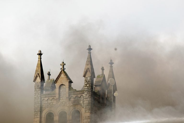 Greater Bible Way Temple burns from a fire in the Parkside neighborhood, Tuesday, Aug. 27, 2019, in Philadelphia. (Margo Reed/The Philadelphia Inquirer via AP)