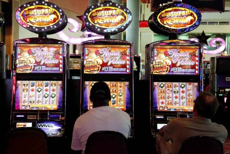 Patrons play the slot machines at Harrah's Casino in Chester, Pa. (Alex Brandon/AP Photo)